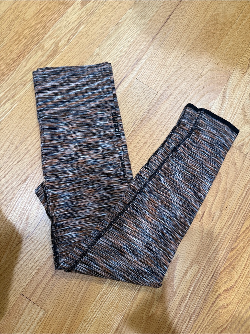 The Upside Marled Leggings in Black & Orange Blend